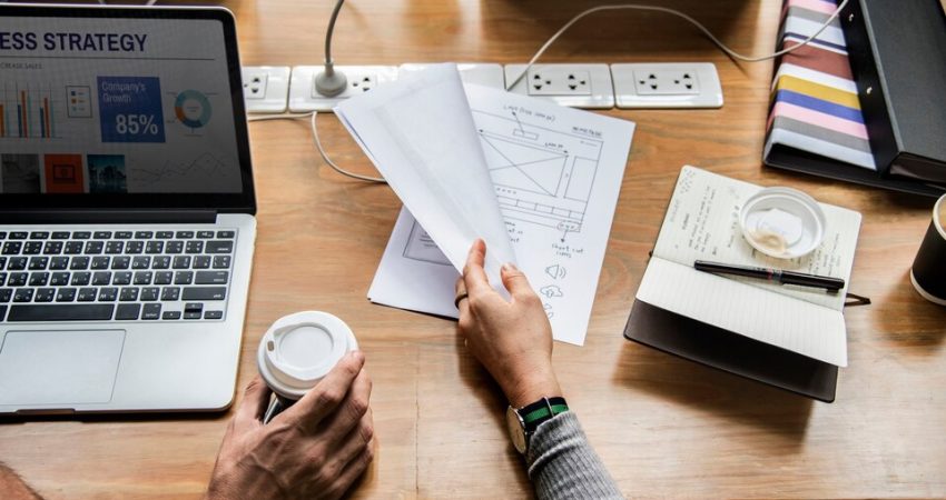 A bustling office space filled with creative professionals collaborating at their desks, embodying the energy of marketing agencies